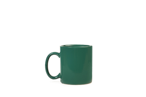 Green mug isolated on a white background with copy space