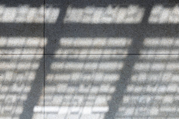 istock Abstract background of sunlight from windows on a gray tiled floor 1359145301