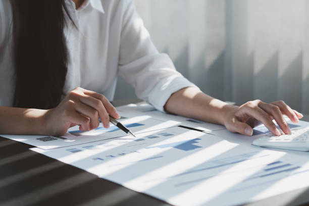 istock Business people or accountants are analyzing graphs on finance, investment, graph chart business strategy ideas, data analysis technology. 1359149944