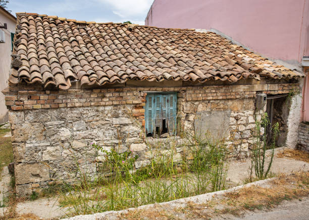 Old abandoned house in Lefkimmi, Island of Corfu, Greece. stock photo