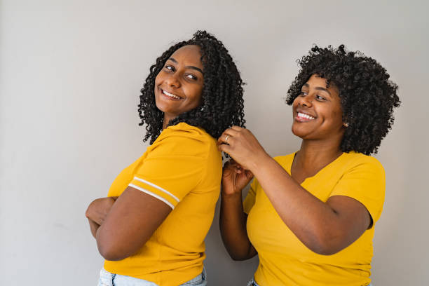 istock Two sisters and wearing yellow clothes 1359153083