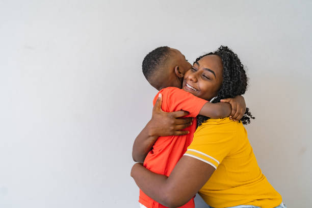 Portrait of a mother hugging her child stock photo