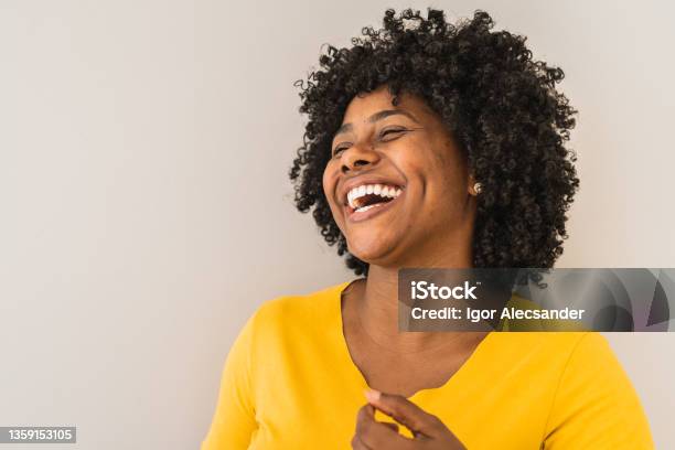Portrait Of A Young Woman Laughing Stock Photo - Download Image Now - One Woman Only, Laughing, Smiling