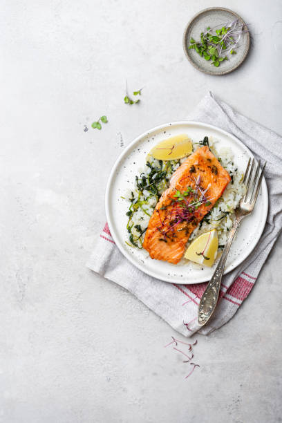 salmon steak with lemon rice and spinach