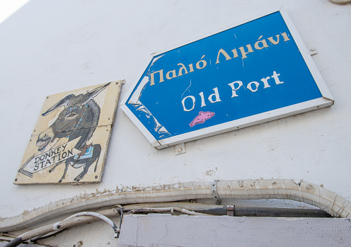 Old Port and Donkey Station Signs in Firá on Santorini in South Aegean Islands, Greece