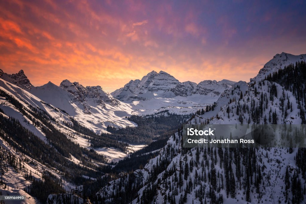 maroon Bells during a vibrant sunset Winter Stock Photo