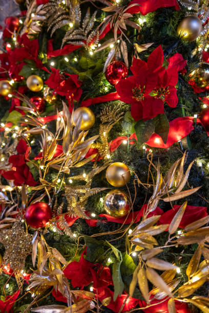 istock Christmas Tree with poinsettia 1359165895