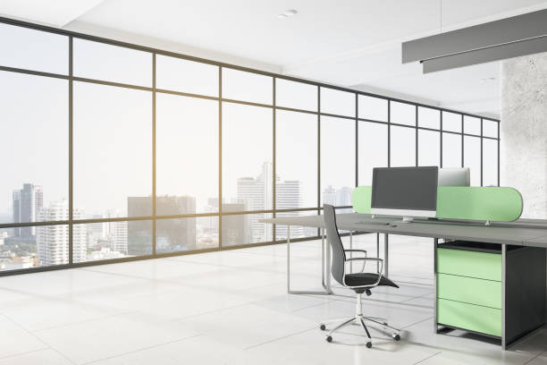 istock Contemporary concrete coworking office interior with empty mock up computer screen, window with city view, furniture, equipment, daylight and technology. Workplace and corporation concept. 3D Rendering. 1359167718