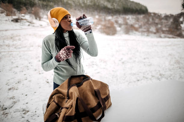 istock Woman drinks water after training 1359168179