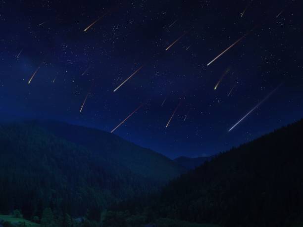 istock Meteor shower in the night sky over the mountains. 1359168969
