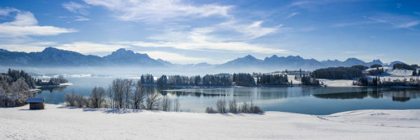 istock panoramic view to alps mountain range and lake Forggensee in Bavaria 1359169144