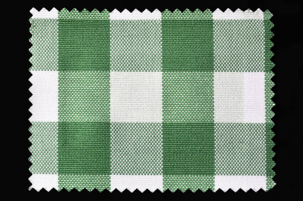 Green and white checkered fabric sample isolated on black background Green and white checkered fabric sample isolated on black background fabric swatch isolated stock pictures, royalty-free photos & images