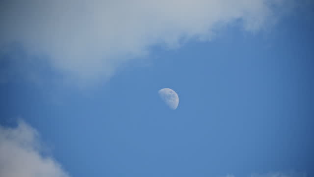 moon in day blue sky