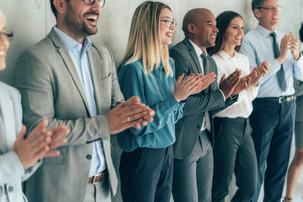 istock Business people applauding 1359174104