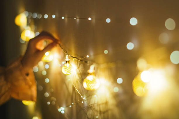 istock Young woman decorating home for Christmas 1359174941