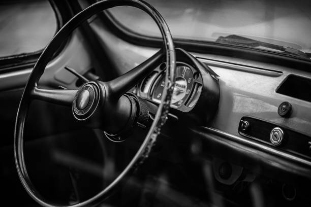 istock wheel and control panel of old retro car 1359177792