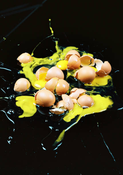 istock Oops! Large number of smashed eggs on the floor of a kitchen, symbolizing destruction or waste 1359178336