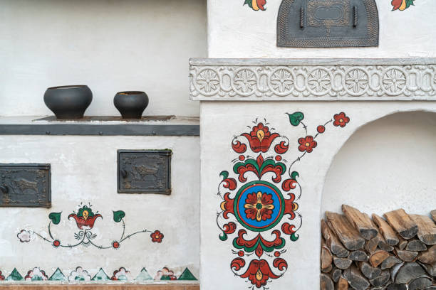 Russian stove with ornaments and firewood close-up