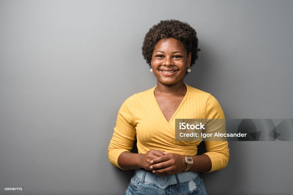 Portrait of a smiling teenage girl in the studio Portrait of a smiling teenage girl in the studio. Brazil Stock Photo