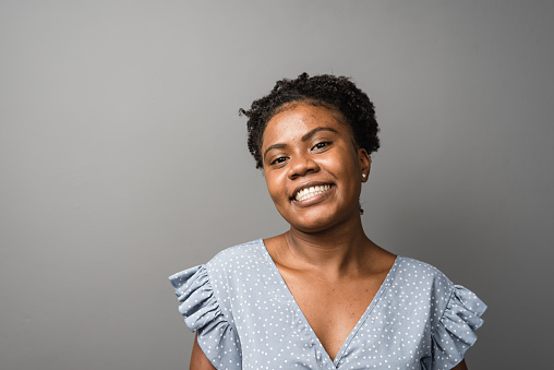 Portrait of a smiling young black woman.