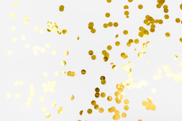istock golden confetti on white background flat lay text place - Image 1359189876