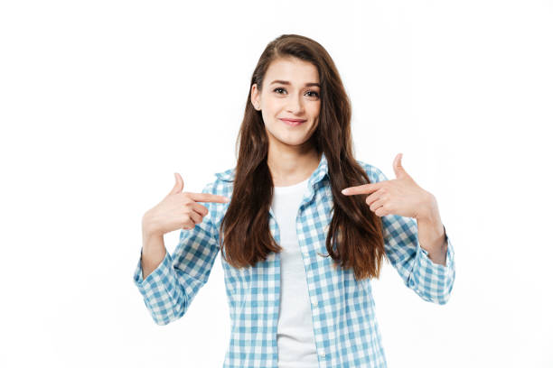 istock Young girl pointing at herself 1359190239