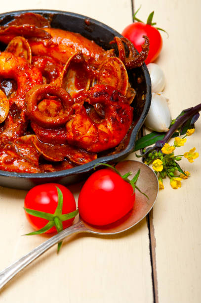 istock fresh seafoos stew on an iron skillet 1359193059