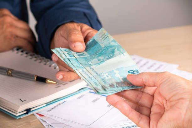 Businessman giving money to his partner when making contract. business and finance concept Businessman giving money to his partner when making contract. business and finance concept. corruption stock pictures, royalty-free photos & images