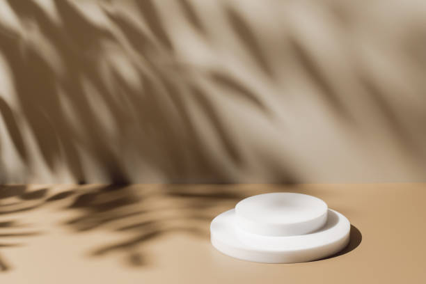 istock scene with white podium on beige background and shadows 1359194667