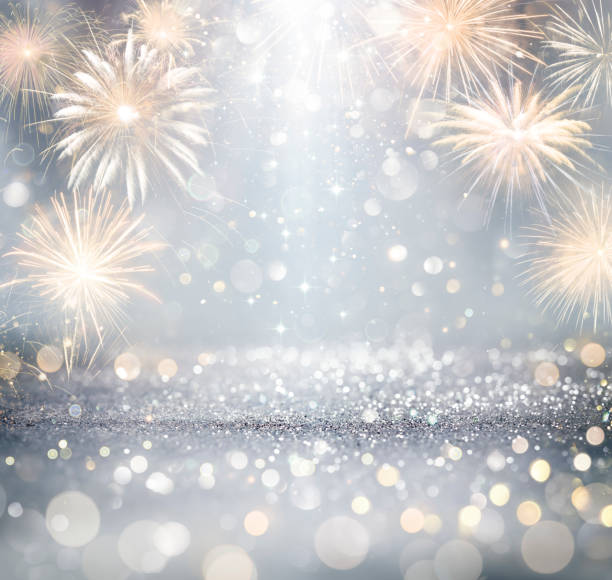 istock Silver Celebration With Fireworks And Glitter - New Year Anniversary With Defocused Abstract Lights 1359199288
