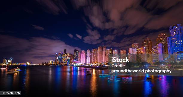 Scenic Night View Of The Skyline Of The Dubai Marina District With Its Tall Skyscrapers Raising Next To The Beach And The Waterfront Dubai Uae Stock Photo - Download Image Now