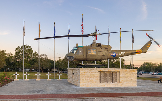 Yorktown, Texas, USA - September 25, 2021: A Bell UH-1 Iroquois Huey Helicopter in display as War Memorial on Main Street