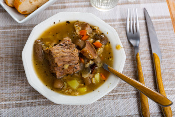 istock Soup with assorted mushrooms, vegetables and pork 1359206786