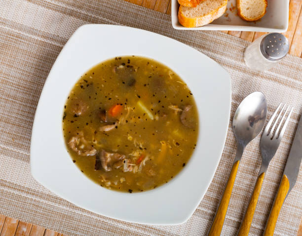 istock Soup with assorted mushrooms, vegetables and pork 1359206796