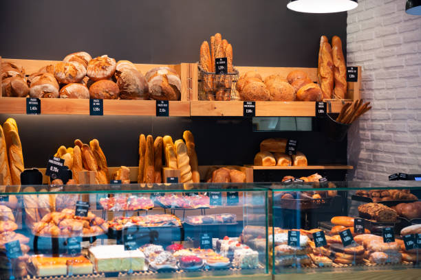 istock Bakery shop with assortment of bread on shelves 1359206832