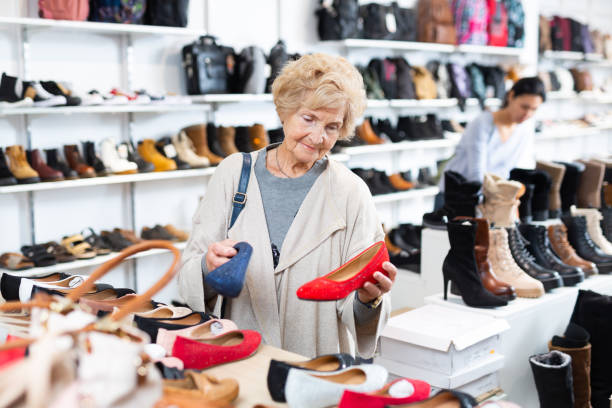 istock Mature woman  chooses ballet flats 1359207219