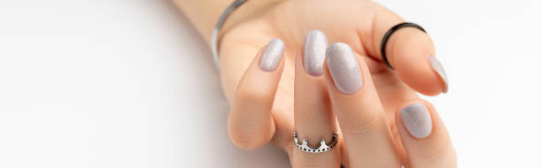 istock Womans hand with grown manicure on white background with copy space 1359208108
