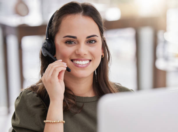 istock Portrait of a young call centre agent working on a computer in an office 1359208122