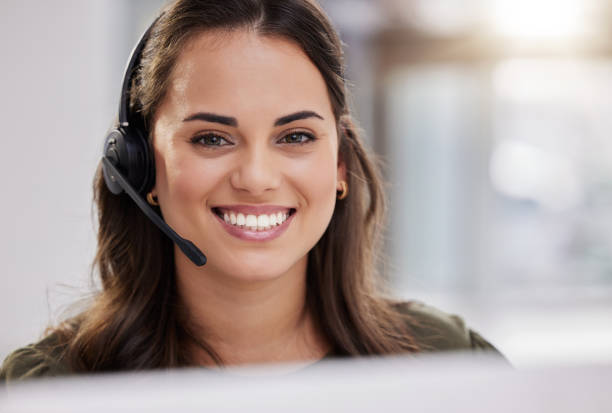 istock Portrait of a young call centre agent working in an office 1359208150