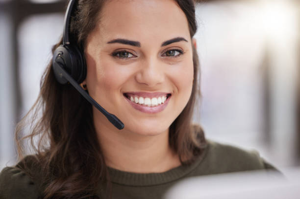 istock Portrait of a young call centre agent working in an office 1359208167
