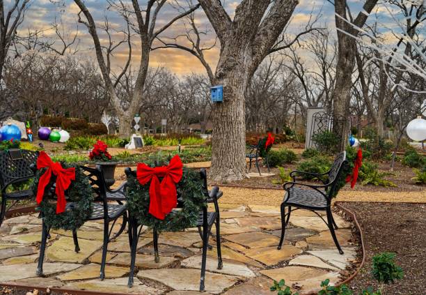 istock Park Benches Decorated with Christmas Wreaths 1359208303