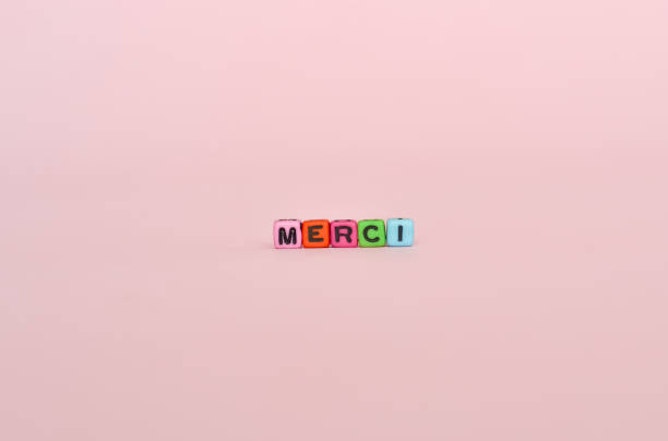 istock Word merci written with colorful letter blocks 1359208823