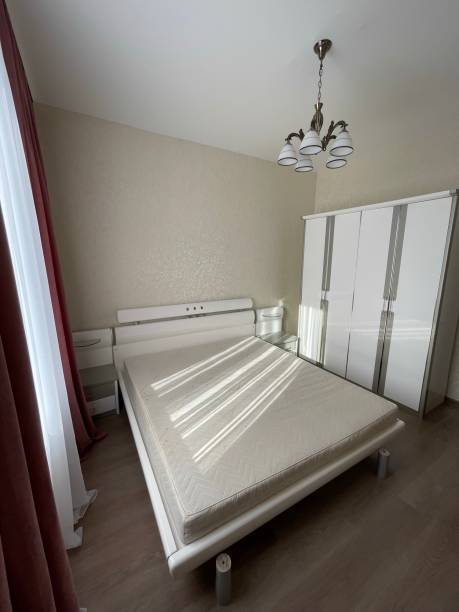 istock new bedroom with white bed and wardrobe 1359212087