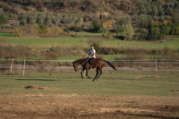 istock Farmer Man Riding Horse on the ranch. 1359212428