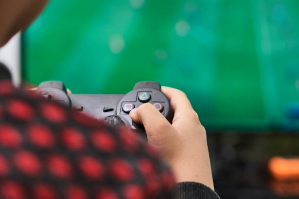 istock A little boy playing soccer on a gaming console 1359213299