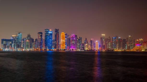 istock view of doha corniche during night along with fanar building. 1359222919