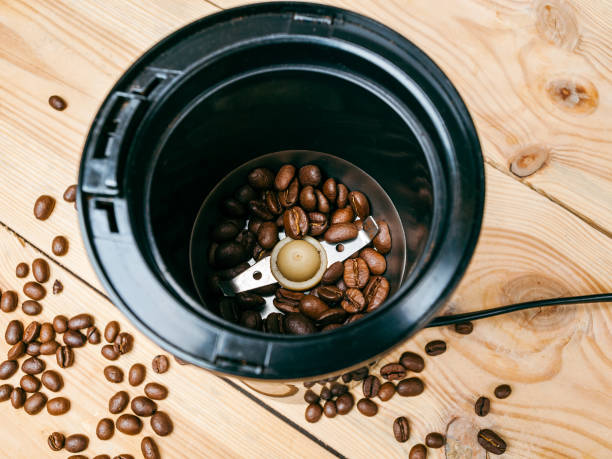 istock Electric coffee grinder for home, grinding roasted coffee beans, compact, with knives 1359224681