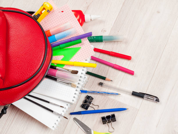 istock School accessories for studying on the background of a backpack, stationery, back 1359225892