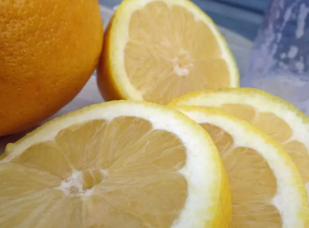 Slices of lemon with blurred background.