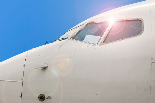 Front of the aiplane highlighting the windows of the cocckpit and sensors of the bodywork.